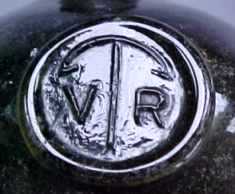 VR seal on black glass lime juice bottle